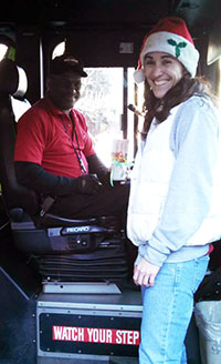Staff Women's Network - Jennifer Castillo presents a mug to Wolfline bus driver
